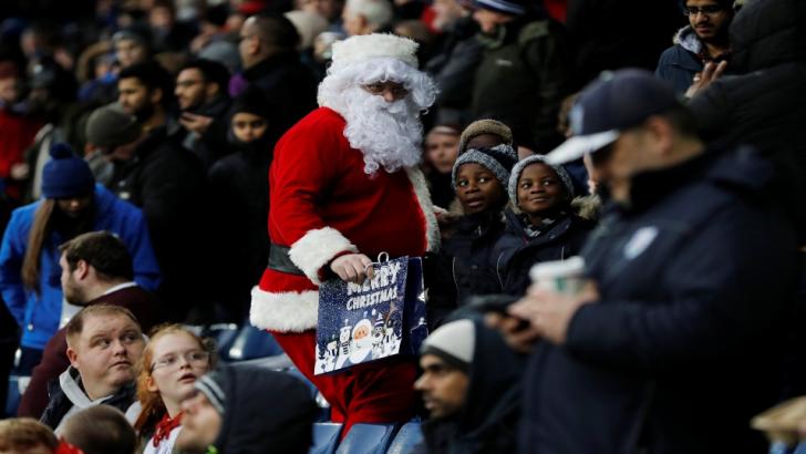 A football fan dressed as Santa Claus